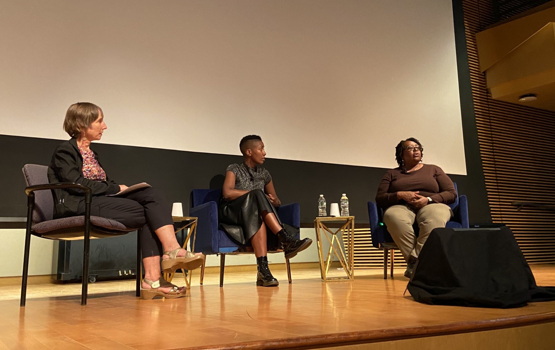A conversation with Amandine Gay, filmmaker of A Story of One’s Own (in the center), and Joyce McMillan, founder of Just Making A Change For Families (on the right), moderated by Shanny Peer, director of the Maison Française (on the left).