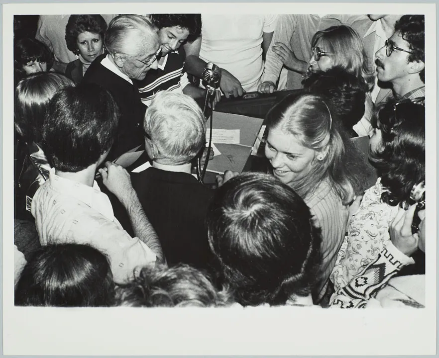 French undersea explorer Jacques Cousteau surrounded by students after a talk, September 25, 1978