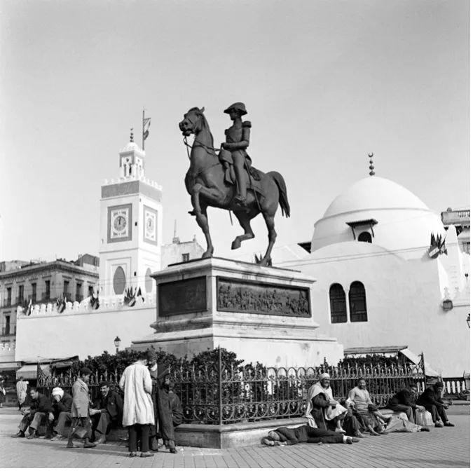 French statue with colonial subjects in foreground